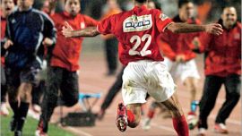 AFP / Egyptian Al-Ahly Mohamed Abou Tarika celebrates after winning the second leg of the African Champions League final match against Tunisian Sportif Sfaxien 11 November