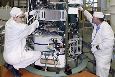 r_Engineers work on a Global Navigation Satellite System (GLONASS) satelite at the NPO PM applied mechanics institute in the Siberian city of Zheleznogorsk