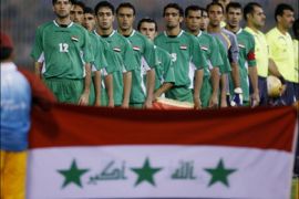 r - The Iraqi team listens to their national anthem before their 15th Asian Games 2006 Men's Group B first round soccer match against