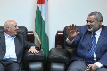 Palestinian Hamas Prime Minister Ismail Haniya (R) attends a meeting with his predecessor Ahmed Qurei (2nd R), Mustafa al-Barghuti (2nd L), an independent MP who has