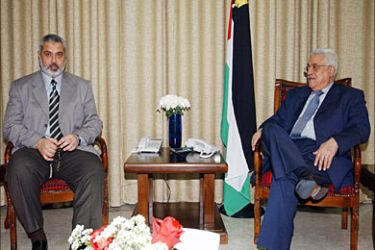 f_In this handout picture released by the Palestinian Press Office, Palestinian leader Mahmud Abbas (R) meets with Prime Minister Ismail Haniya (L) in Gaza City