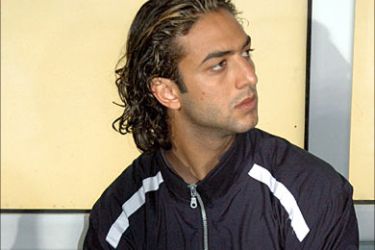 epa00636098 Egyptian striker Mido stands in the tunnel leading to the field ahead of the African Nations Cup final soccer match between Egypt and Ivory Coast at the Cairo International Stadium in Egypt Friday, 10 February 2006. Egypt will play the final without Tottenham's Mido, who was banned from representing his country for six months for dissent after he had a touchline row with coach Hassan Shehata over being substituted in the semifinal. EPA/-