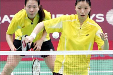 AFP / Chinese Doubles badminton players Jiewn Zhang and Wei Yang compete during the Women's team league stage Pool W badminton match between China and Indonesia at the 15th