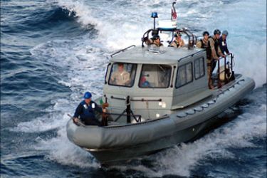 f_This 10 January, 2007 US Navy handout image shows a Visit, Board, Search and Seizure (VBSS) team aboard the Whidbey Island-class dock landing ship USS