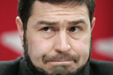 Maher Arar listens to a question during a news conference in Ottawa January 26, 2007. Canada formally apologized on Friday to Arar, who was deported to Syria by U.S.