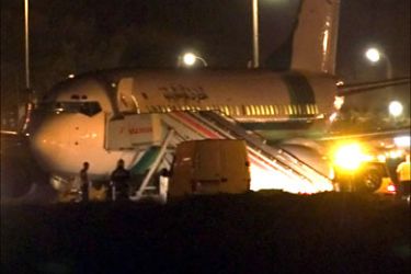 r_Spanish security forces surround a hijacked Air Mauritania Boeing 737 passenger plane after it landed at Gando airport in Las Palmas on the island of Gran Canaria in Spain's