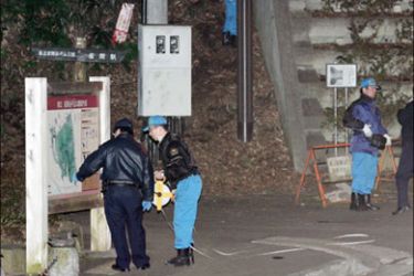 AFP - Police inspect a park where a small explosion was caused near the Camp Zama of the US Forces in Japan, in Zama city