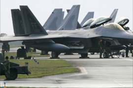US Air Force's new stealth fighters F-22A Raptor (L) are lined up at the Kadena US Air Base, in Kadena town, southern island of Okinawa, 18 February 2007