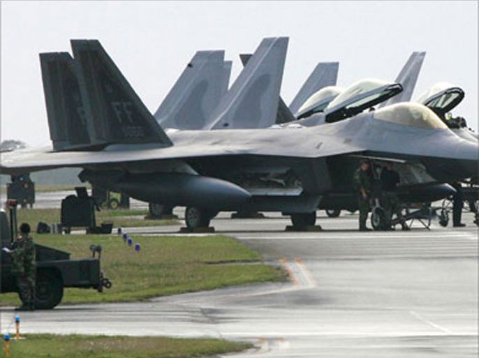 US Air Force's new stealth fighters F-22A Raptor (L) are lined up at the Kadena US Air Base, in Kadena town, southern island of Okinawa, 18 February 2007