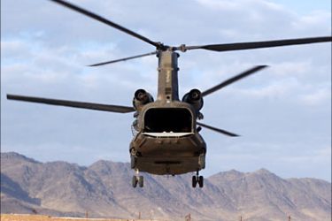 f_This picture taken 08 January 2007 shows a US Chinook helicopter flying over the southern Afghan city of Kandahar. Eight US service members were killed and 14 injured when