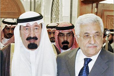 AFP / Saudi Arabia's King Abdullah bin Abdul Aziz walks hand in hand with Palestinian leader Mahmud Abbas (R) after the signing of an inter-Palestinian peace deal in Mecca 08 February 2007. Rival Palestinian factions signed today a