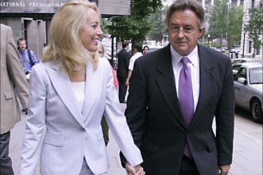 epa00772219 Outed CIA official Valerie Plame, with her husband Ambassador Joe Wilson, leave a press conference at which they announced their lawsuit against US Vice President Dick Cheney, Karl Rove and Lewis "Scooter" Libby
