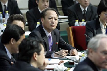 f_North Korean negotiators (C-L) sit at the opening of six-party denuclearization working group talks in Beijing's Diaoyutai State Guesthouse, 17 March 2007