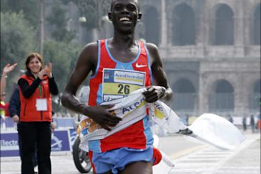 f_Kenya's Chelimo Kemboi celebrates his victory in the XIII Rome's marathon 18 March 2007. AFP PHOTO / ANDREAS SOLARO