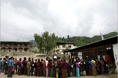 REUTERS/ Bhutanese people stand outside a polling station in Lango village, April 21, 2007. The people of the isolated Himalayan kingdom of Bhutan streamed into polling stations on