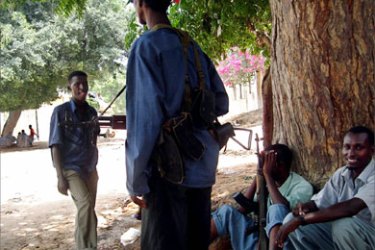 Armed Islamist militiamen are gathered in the shade in a Mogadishu suburb, 18 April 2007. At least nine civilians were killed and 12 wounded in renewed fighting, 19 April 2007 between Ethiopian forces and the insurgents, eight of whom died in a rocket attack on a bus station.