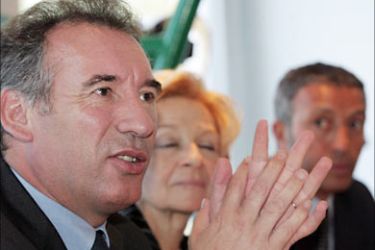 f_French centrist presidential candidate of the Union for the French Democracy (UDF) Francois Bayrou delivers a speech next to Former minister delegate for Equal