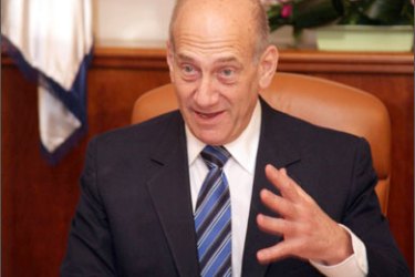 Israeli Prime Minister Ehud Olmert is seen in his office during an official meeting with US Secretary of Defense Robert Gates (unseen) his Jerusalem office, 19 April 2007
