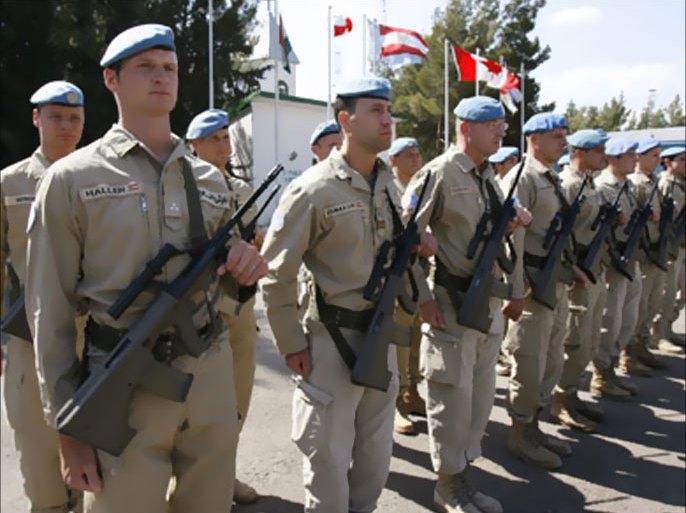Austrian U.N. peacekeepers stand in guard during U.N. Secretary-General Ban Ki-moon's visit to UNDOF headquarter in Nabea al Faouar village in the Golan Heights near the border with Israel