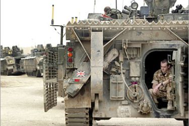 . AFP / A British soldier sits inside an armored vehicle outside Shatt al-Arab Hotel base during a handover ceremony in the southern Iraqi city of Basra, 08 April 2007. The British military handed over today a key base in the southern Iraqi city of Basra to the Iraqi army as part of its gradual withdrawal plans from the war-torn country. The military transferred the Shatt