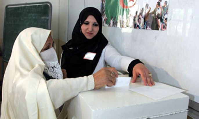 Women cast their ballots at a polling station in Algiers City 17 may 2007. In Algeria's only third multiparty parliamentary election, there is concern that too few citizens will bother