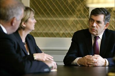 r_Britain's Prime Minister Gordon Brown (R) talks with Home Secretary Jacqui Smith (C) and Home Office Minister for Security Admiral Alan West after a meeting