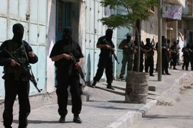 Palestinian militants of Hamas radical Islamist movement surround the headquarters of the pro-Fatah security services during clashes in Gaza City, 14 June 2007. Hamas