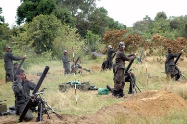 Sri Lanka's elite Special Forces commandos fire shells 21 June 2007 in the eastern jungles of Thoppigala during an operation against Tamil Tiger guerrillas.