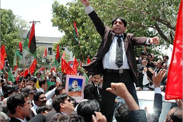 REUTERS/ A lawyer chants slogans during an opposition rally to protest against a government crackdown on the opposition and media in Lahore June 7, 2007. Pakistan's President Pervez