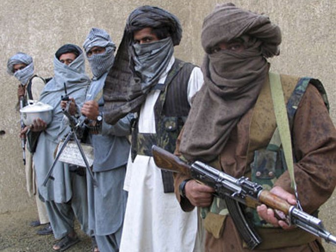 Taliban guerrilla fighters hold their weapons at a secret base in eastern Afghanistan in this February 3, 2007 file photo. Afghanistan’s Taliban movement said July 21, 2007,