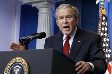 R/U.S. President George W. Bush speaks at a press conference in the Brady Press Briefing Room at the White House in Washington July 12, 2007. REUTERS/Jason Reed (UNITED STATES)