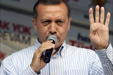 r_Turkey's Prime Minister Tayyip Erdogan gestures to his supporters during a rally by his ruling AK Party as he campaigns for the upcoming early parliamentary elections