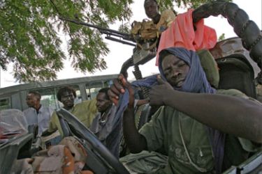 Fighters of the Sudan Liberation Army/Movement (SLA/M) Minni Minawi faction man their armoured Toyota Land Cruiser at Graida Internally Displaced People's Camp in Southern Darfur, 18 July 2007