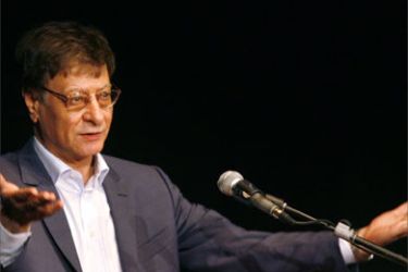 Palestinian poet and journalist Mahmoud Darwish gestures during his show in the northern Israeli city of Haifa, 15 July 2007.