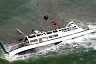 R/A TV grab shows a ferry after it capsized off San Francisco town in Quezon province, about 150 km (93 miles) south of Manila, July 12, 2007. Twelve people were killed and scores were missing after the Blue Water Princess sank off the central Philippines before dawn on Thursday, officials said. REUTERS/ABS-CBN via Reuters TV (PHILIPPINES) PHILIPPINES OUT. EDITORIAL USE ONLY. NOT FOR SALE FOR MARKETING OR ADVERTISING CAMPAIGNS. NO ARCHIVES. NO SALES.