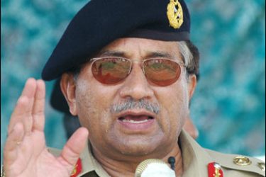 R/Pakistan's President Pervez Musharraf speaks to flood victims during a visit to the storm-hit town of Turbat, 550 km (344 miles) west of Karachi, in this July 6, 2007 file photo. Pakistan's embattled President Pervez Musharraf may quit