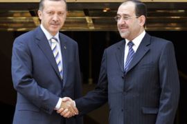 Turkish Prime Minister Tayyip Erdogan (L) and his Iraqi counterpart Nuri al-Maliki pose for the media during a welcome ceremony in Ankara August 7, 2007. al-Maliki