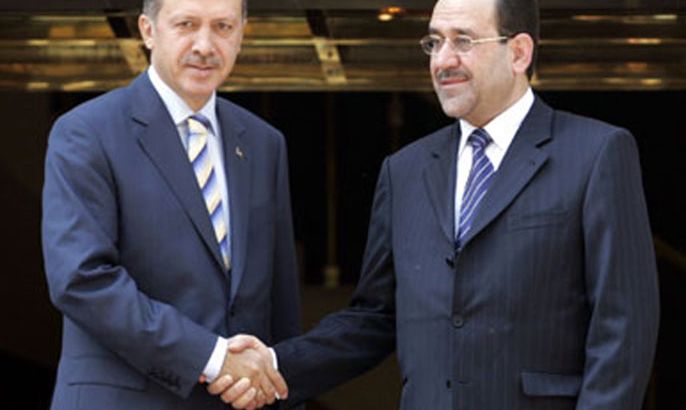 Turkish Prime Minister Tayyip Erdogan (L) and his Iraqi counterpart Nuri al-Maliki pose for the media during a welcome ceremony in Ankara August 7, 2007. al-Maliki