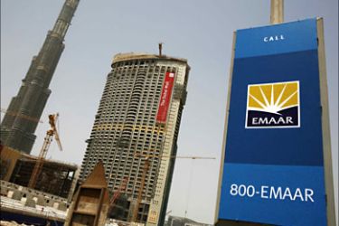 r_A sign of Emaar, the largest Arab real estate developer by value, is seen beside the Burj Dubai, the highest tower in the world, in Dubai August 22, 2007