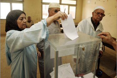 REUTERS/Electors casts their votes during the general elections at a polling station in Sale