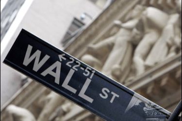 F/The New York Stock Exchange is seen in the background of this Wall Street sign 16 August 2007 in New York.