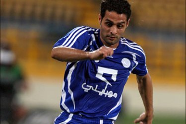 afp : Saudi club Al-Hilal's player Yaser al-Qahtani (front) leaves Al-Kuwait club player Yaqub al-Taher (back) behind during their Gulf Council Championship League football