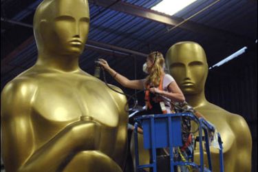 r/Dena D'Angelo works on an Oscar statue which is being prepared for the 80th Academy Awards at a storage facility in Saugus, California October 10, 2007