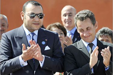 AFP / AFP POOL FOR REUTERS ONLY - Morocco's King Mohammed VI (L) applauds beside French President Nicolas Sarkozy during a visit to a center for delinquents 24 October