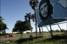 r/A roadside billboard of guerrilla icon Ernesto "Che" Guevara stands on a highway outside Havana October 4, 2007.