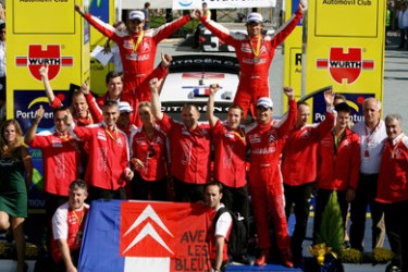 French rally driver Sebastien Loeb (U R ), co-driver Daniel Elena and Team Citroen celebrate on the podium after winning the 43rd Rally of Catalunya , in Salou,
