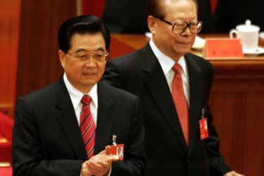 AFP/ Chinese President Hu Jintao (L) applauds as former president Jiang Zemin (R) takes his seat for the opening session of the ruling Communist Party's five-yearly congress, 15 October 2007 at the Great Hall of the People in Beijing.