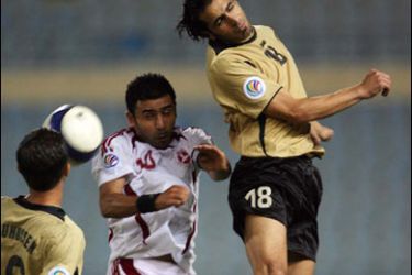f/Jordanian team Shabab Al-Ordun's Shadi Abu-Hashhash (R) and Hazem Abu Hussein (L) battle for the ball against Abbas Atwi (C) of Lebanon's Al-Nejmeh during their semi-final match of the Asian Football Confederation (AFC) Cup at Beirut Sports City stadium, 23 October 2007