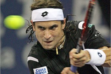 AFP / David Ferrer of Spain hits a backhand return against Andy Roddick of the US during their 2007 Tennis Masters Cup Shanghai semi-final at the Qizhong Tennis Stadium in