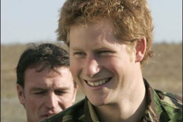 r/Britain's Prince Harry (R) smiles during his visit to the Royal Navy's fleet diving squadron at Horsea Island in Portsmouth, southern England, October 31, 2007. It was Prince Harry's